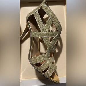 Marc Jacob’s gold strappy heels.